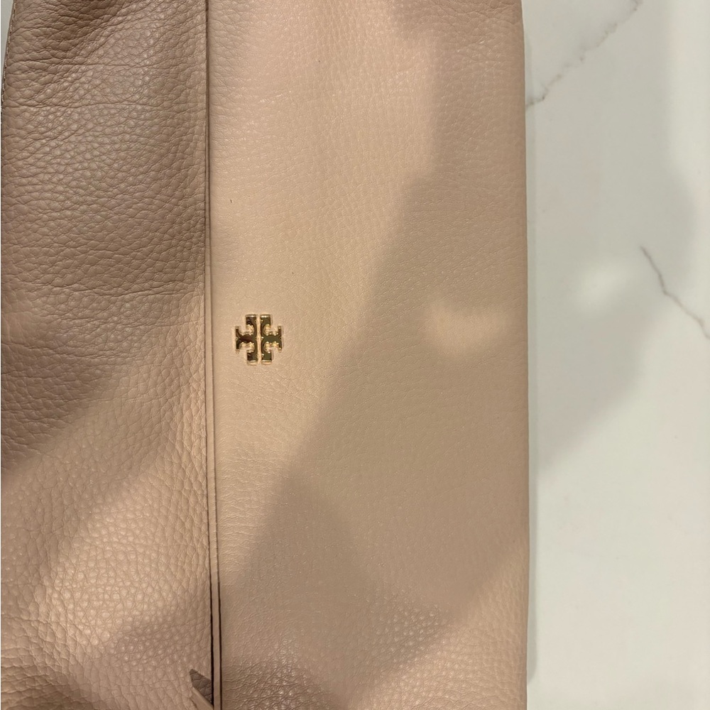 Tory Burch blush colored cross body flap.